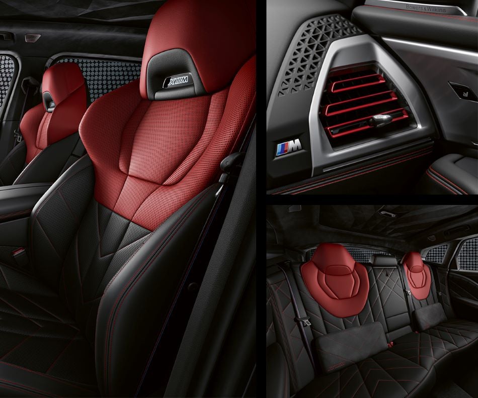 Detail of front seats, clad in exclusive BMW Individual Fiona Red & Black Merino Leather with exclusive M Signature Trim and red stitching and accents. Detail of red accented vent. Detail of rear M Lounge with exclusive XM pillows in BMW of Akron | Akron OH