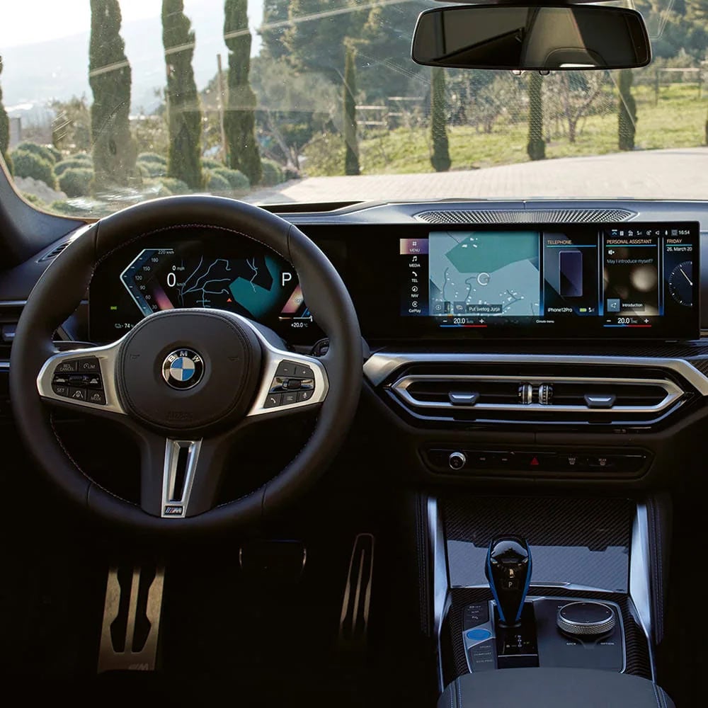 A driver's eye view of steering wheel and controls of the BMW i4 | BMW of Akron in Akron OH